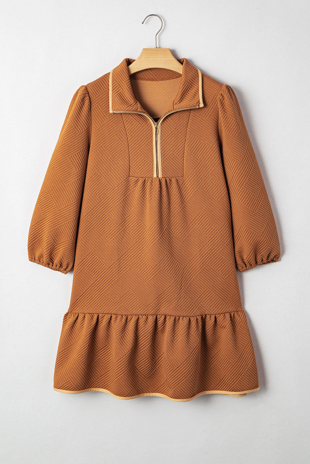 Desert gold textured mini dress on hanger with quarter-zip neckline and tiered skirt
