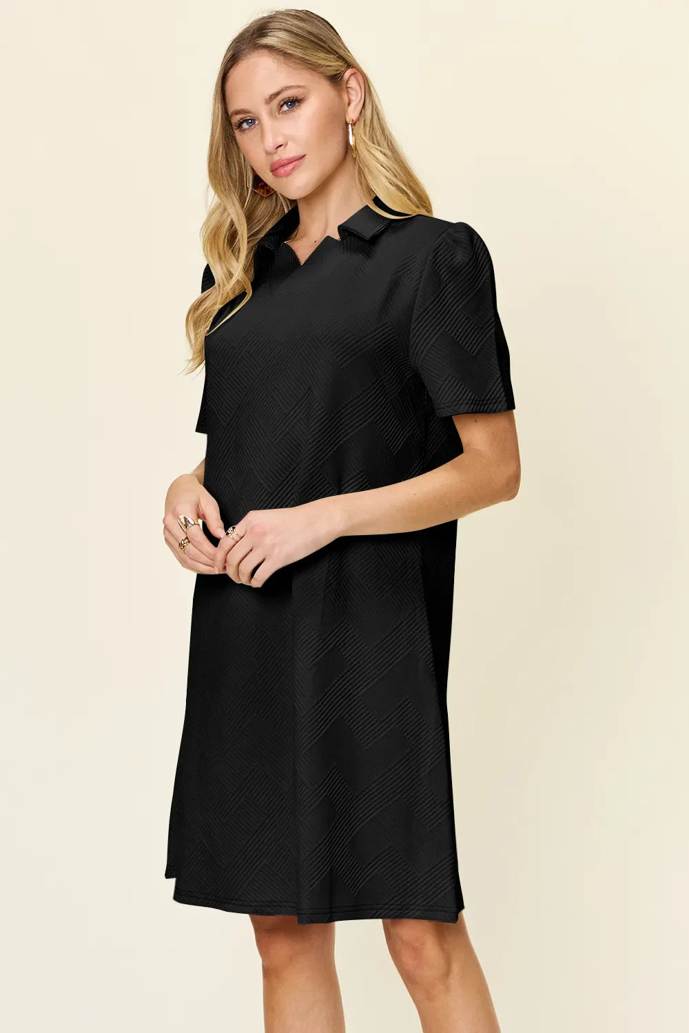 Black textured collared short-sleeve dress from front, above-knee length