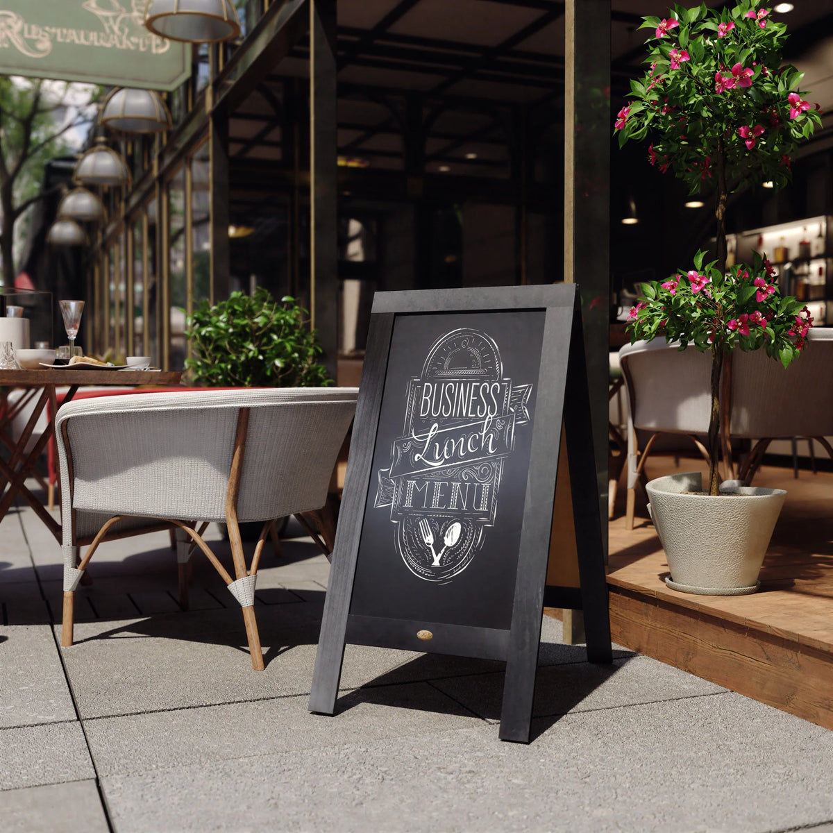 Black double-sided A-frame chalkboard with menu text on front