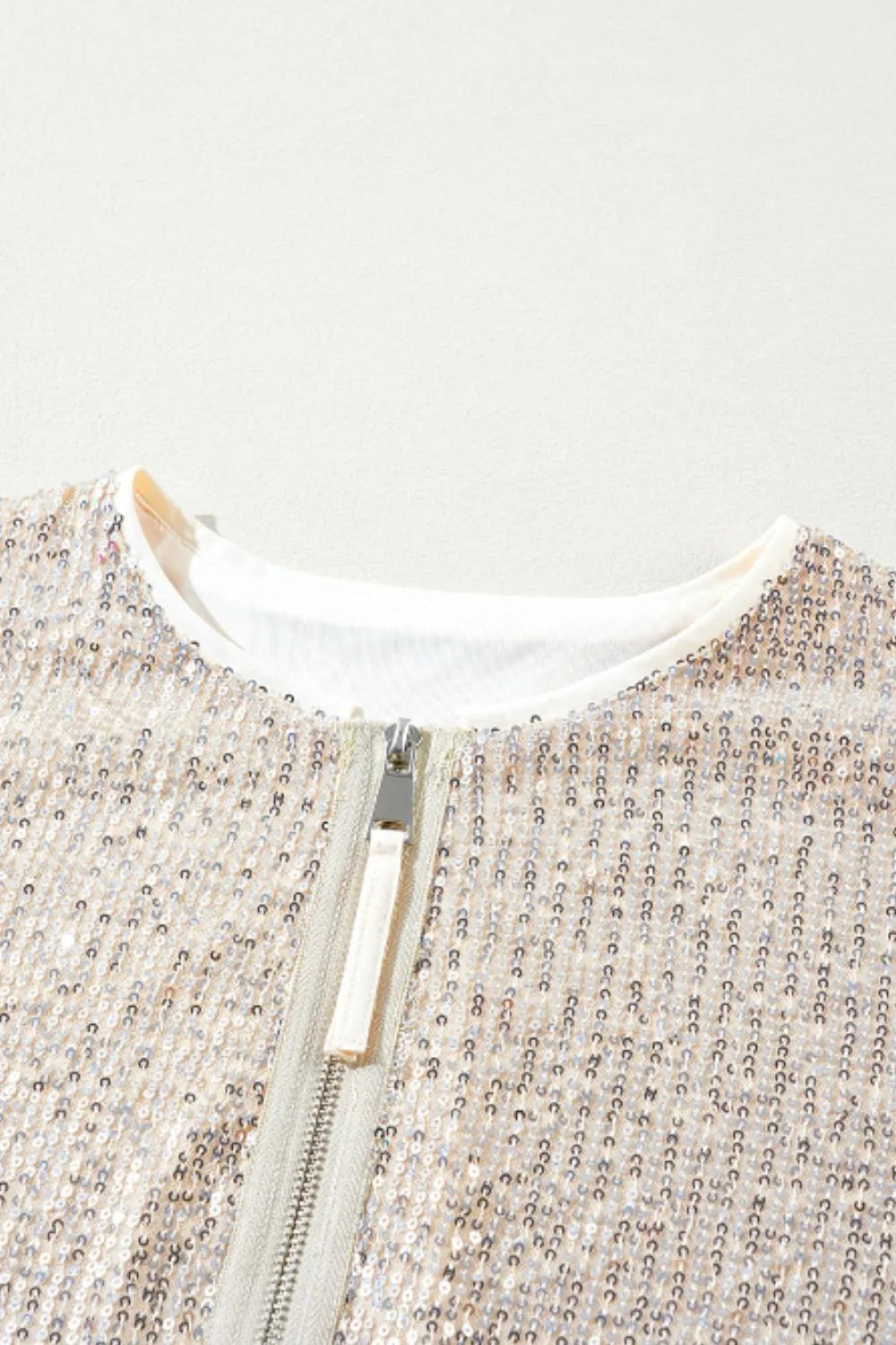 Cream sequin zip-up jacket neckline and front zipper