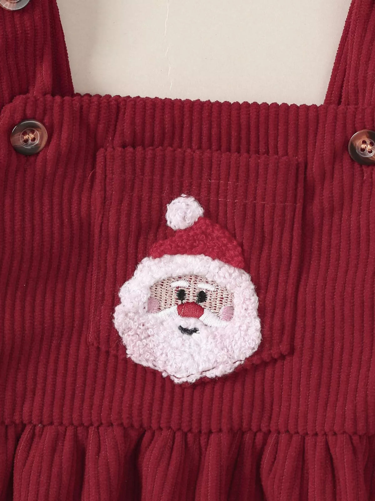 Burgundy corduroy-style overall dress with embroidered Santa face applique