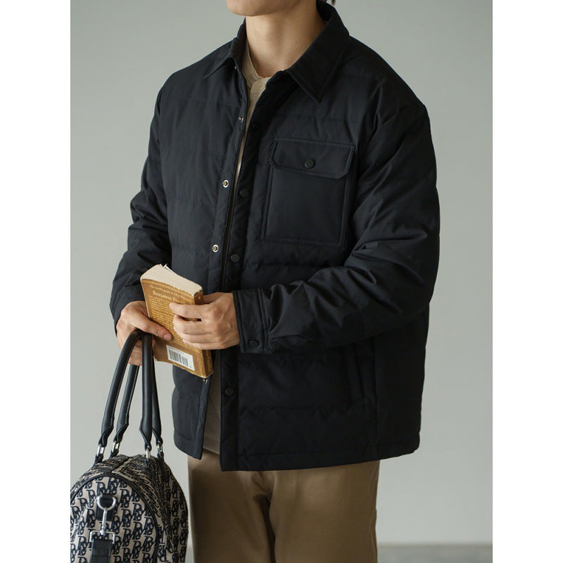 Men's short puffer jacket in black with baseball collar, snap button front, and chest pocket