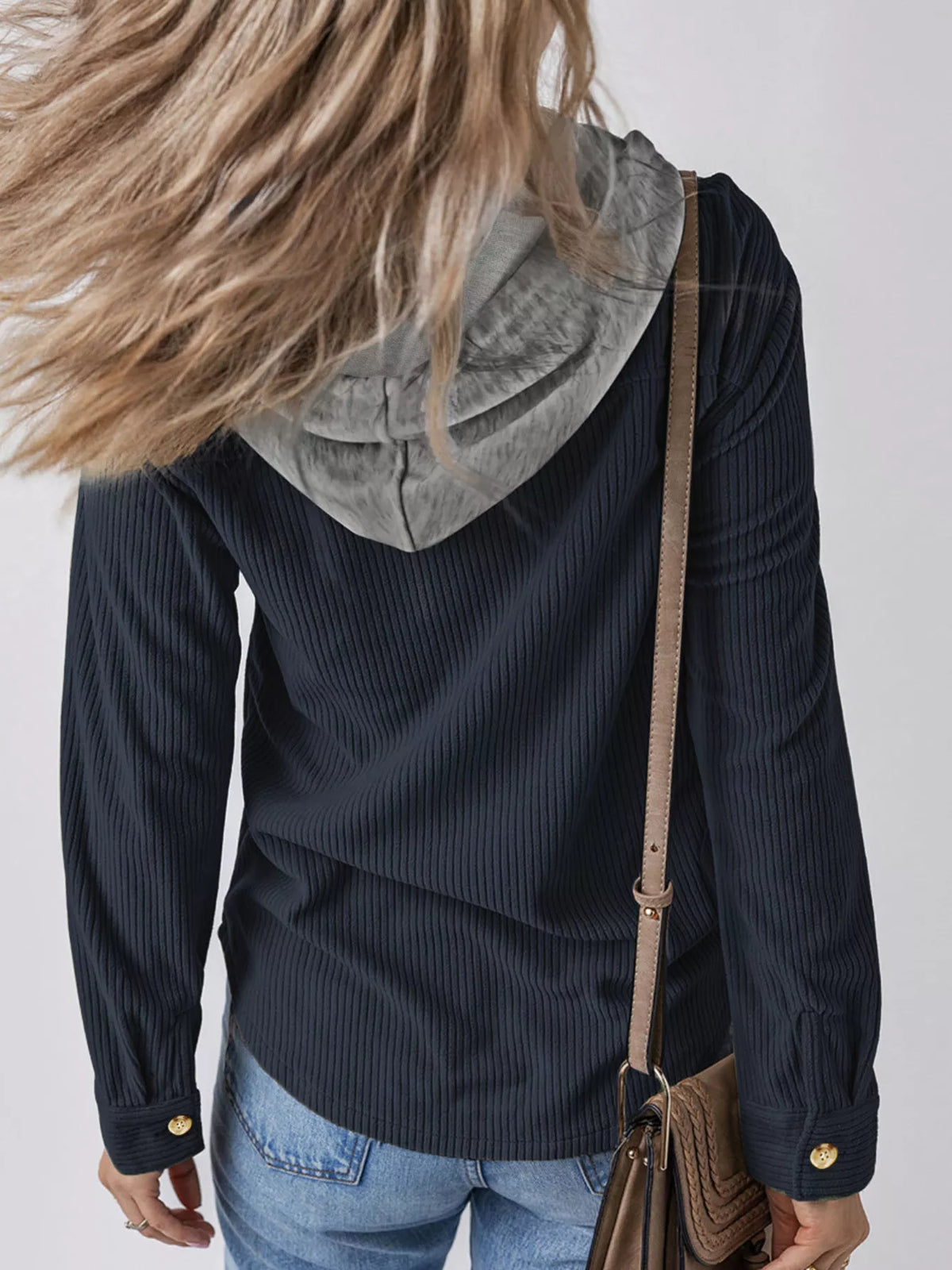 Navy corduroy hooded jacket with gray hood lining, button cuffs