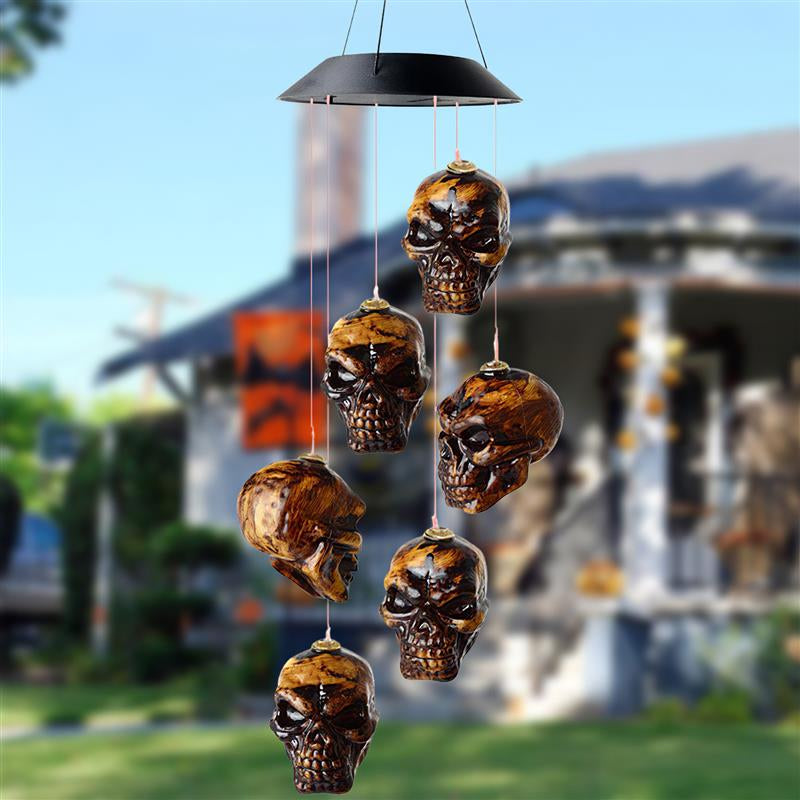 Solar LED skull wind chime with black lantern-style top and hanging skulls