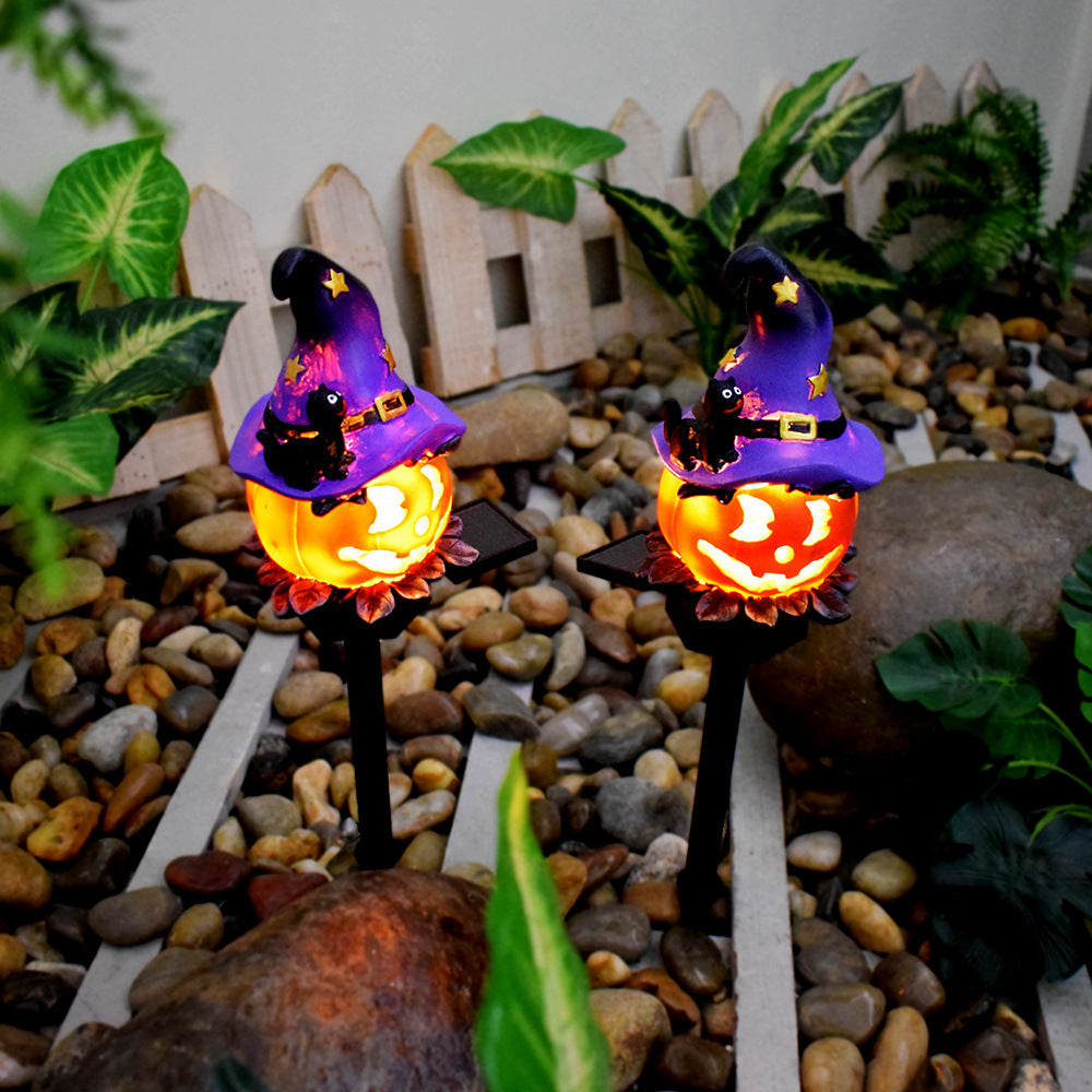 Solar Halloween pumpkin lantern stake light pair with purple witch hats and glowing pumpkin faces