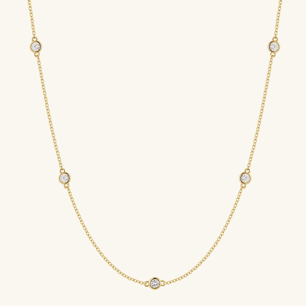 Gold filled chain necklace with five round diamond-like stones
