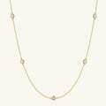 Gold filled chain necklace with five round diamond-like stones