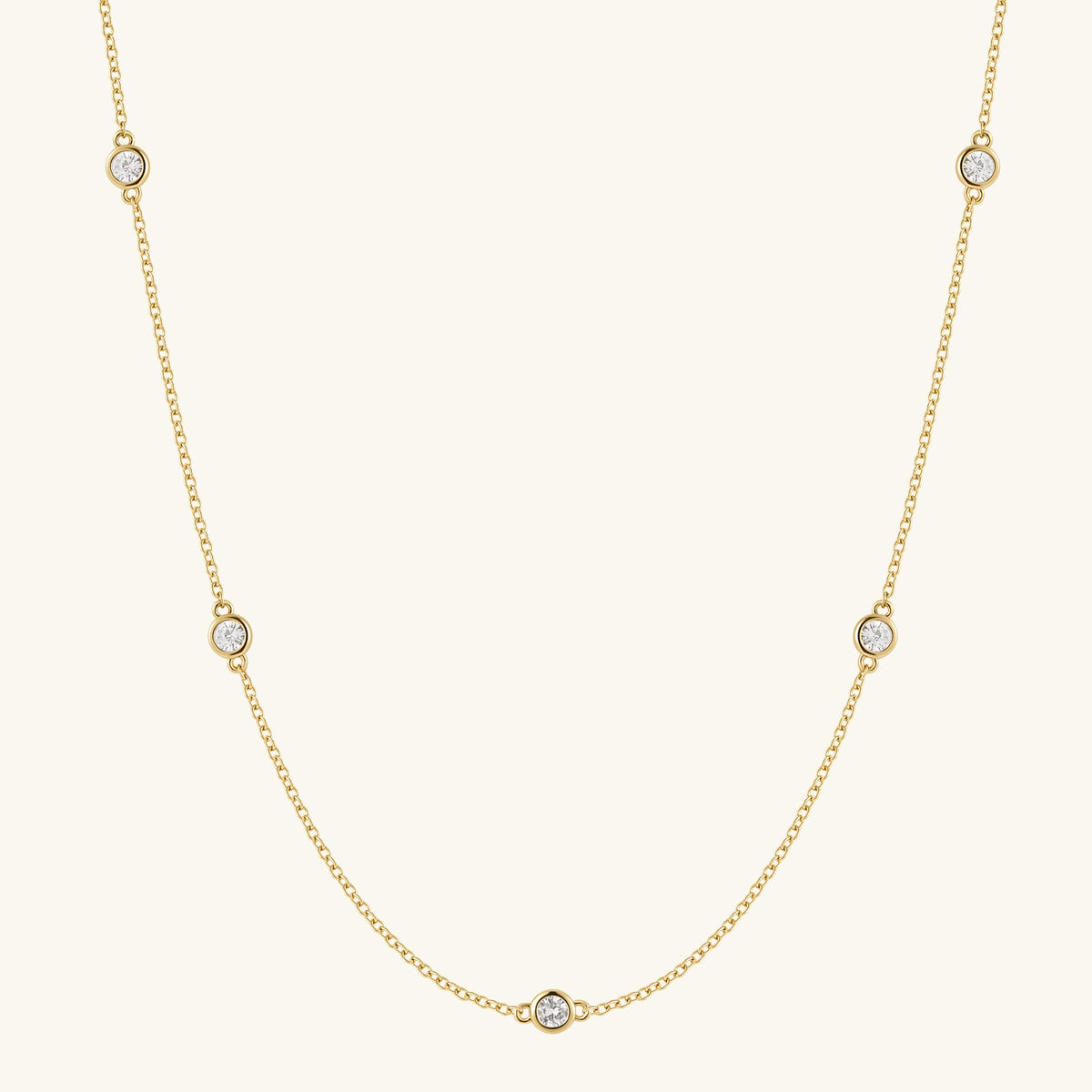 Gold filled chain necklace with five round diamond-like stones
