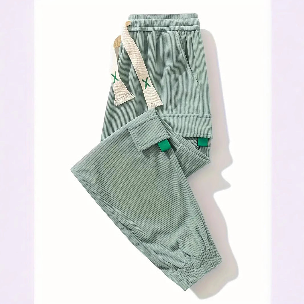 Light green corduroy pants with elastic waistband and side cargo pockets