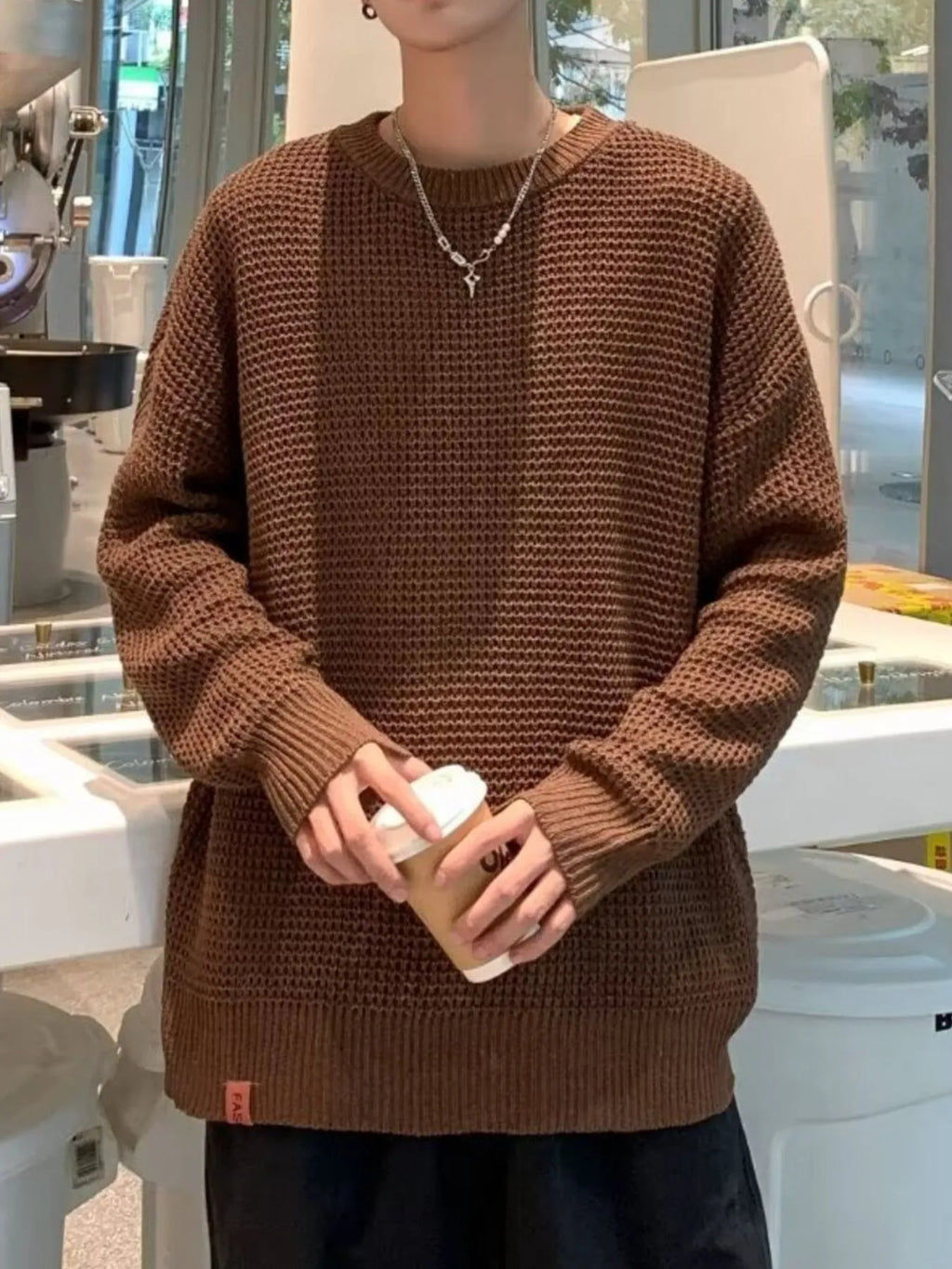 Brown waffle-knit crewneck sweater, long sleeves, ribbed cuffs and hem