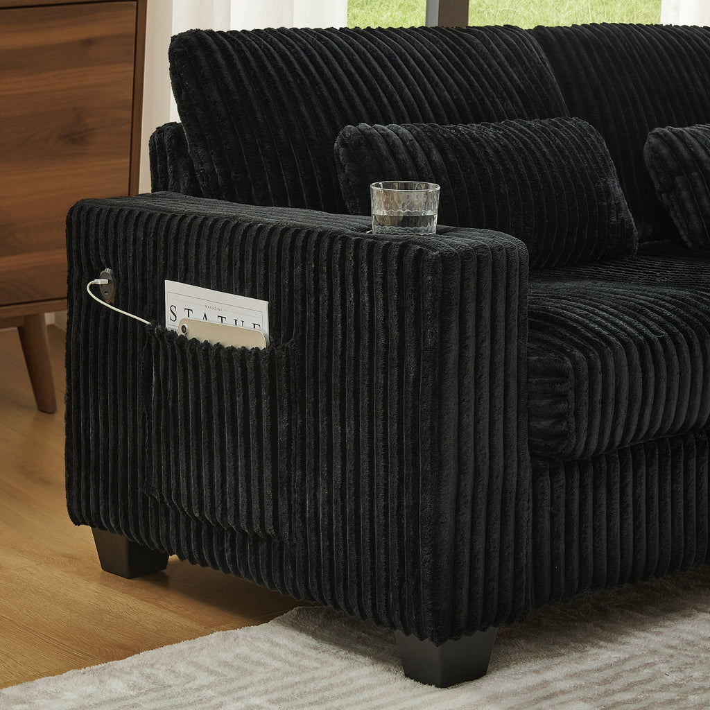 Black corduroy sectional sofa armrest with side pocket detail
