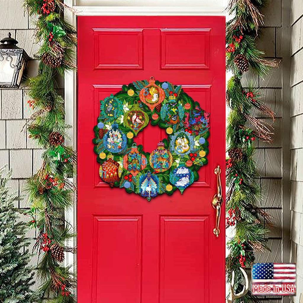 12 Days of Christmas door wreath with colorful numbered ornaments on a green foliage base