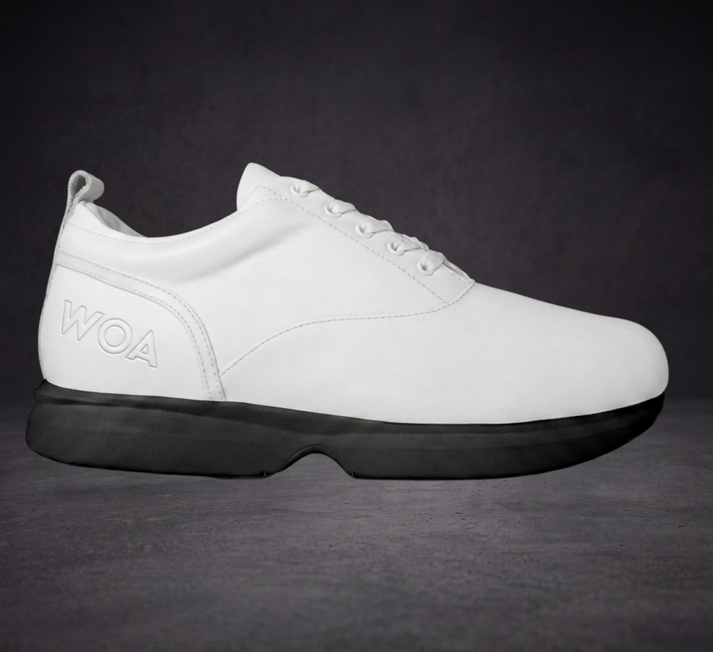 White low-top sneaker with black outsole, lace-up, WOA logo
