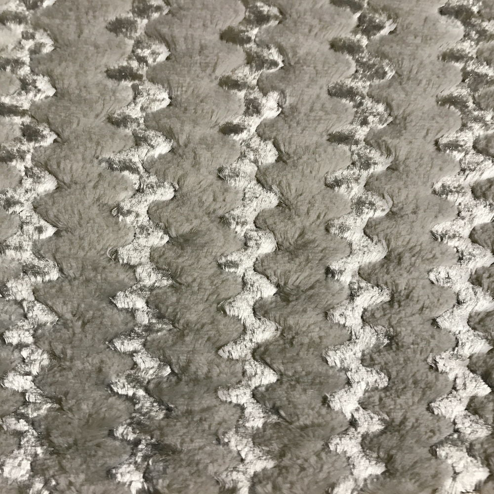 Light upholstery fabric swatch with tight houndstooth pattern texture