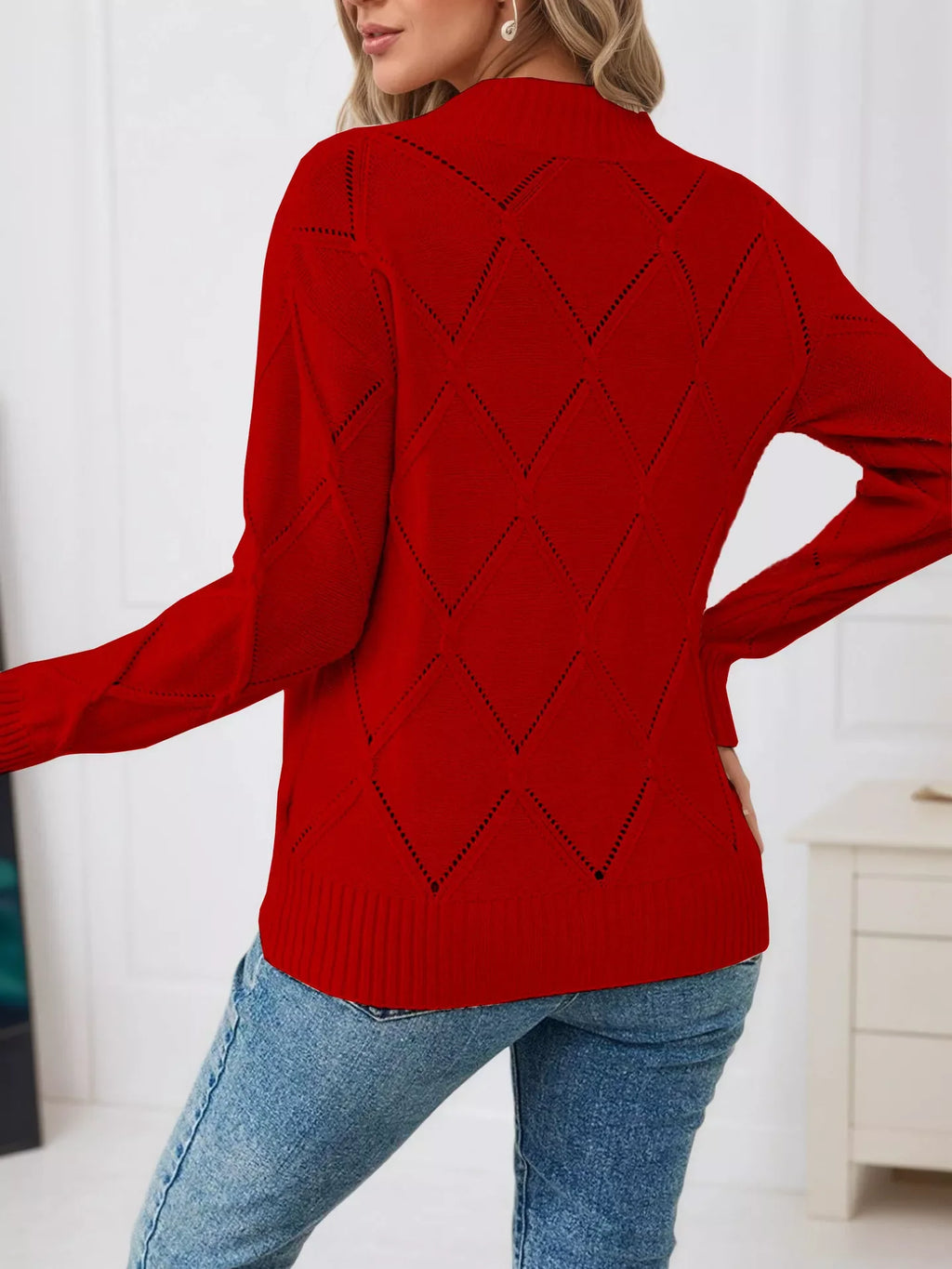 Red diamond eyelet long-sleeve knit top with ribbed cuffs and crew neckline