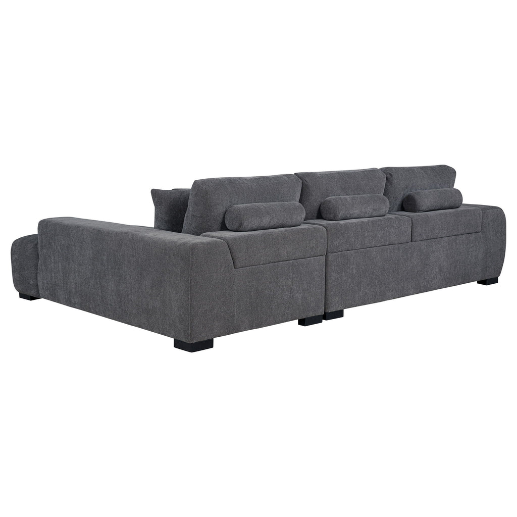 Charcoal gray sectional chaise sofa with boxy arms, low legs, and built-in back cushions