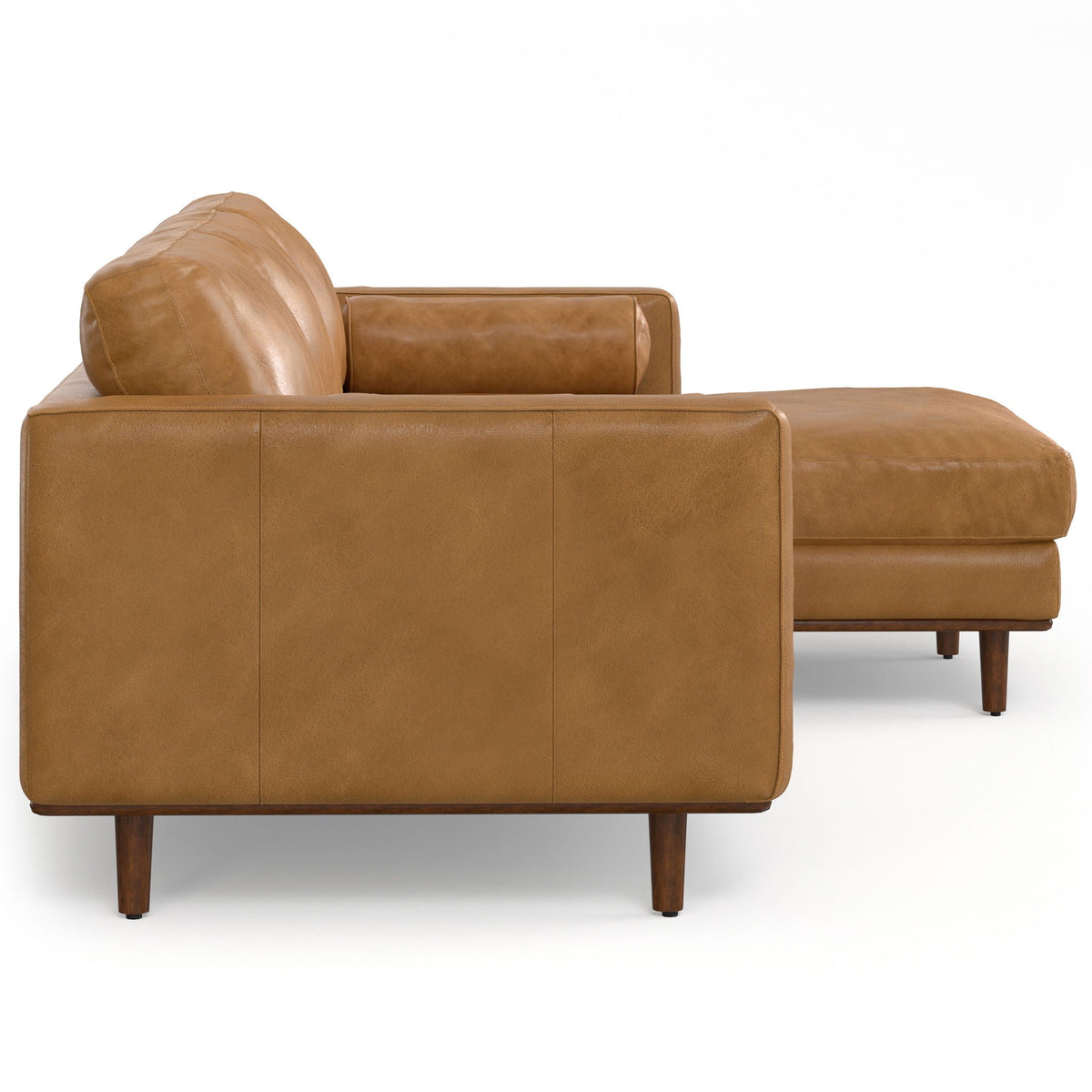 Upholstered sectional sofa in tan fabric with boxy cushions and deep chaise