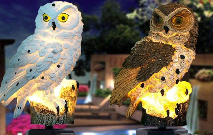 Outdoor solar owl garden light, glowing white and brown owl on black stake base