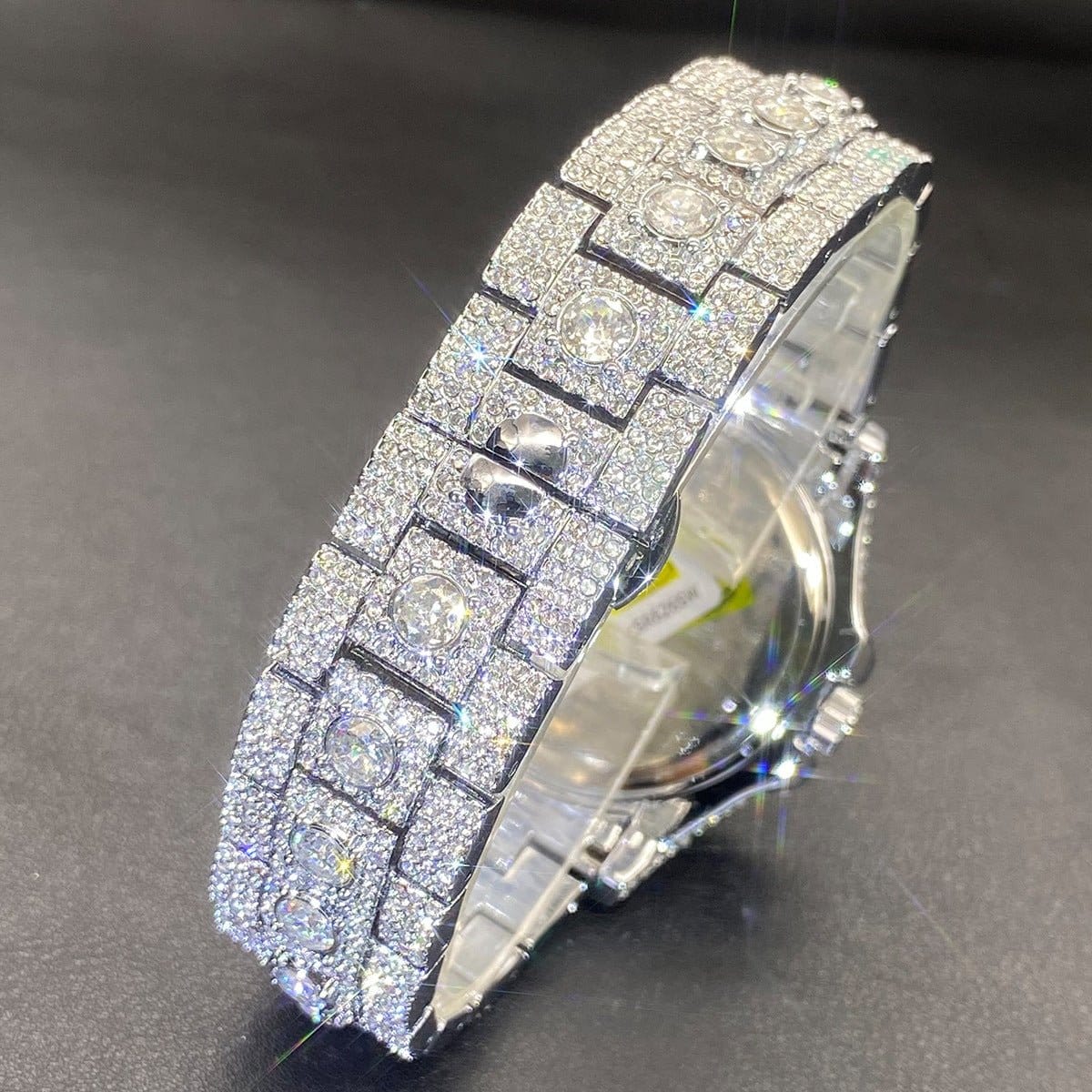 Silver rhinestone hip-hop watch showing crown side and stacked link bracelet