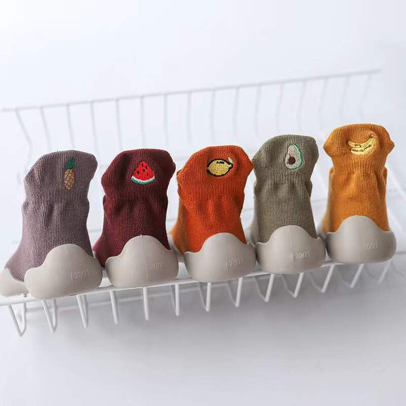 Set of knitted barefoot sock shoes with embroidered fruit patches, assorted colors.