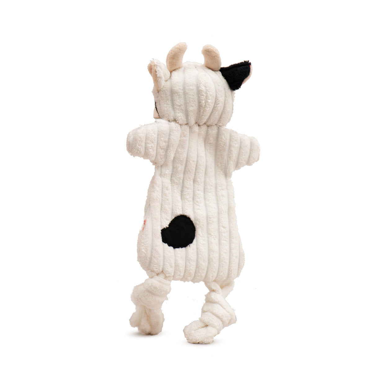 White plush dog toy from back view with black heart-shaped patch