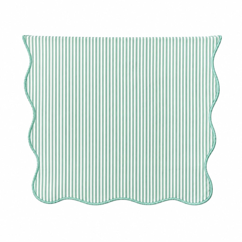 Sage green and white striped table runner with scalloped edges, lined