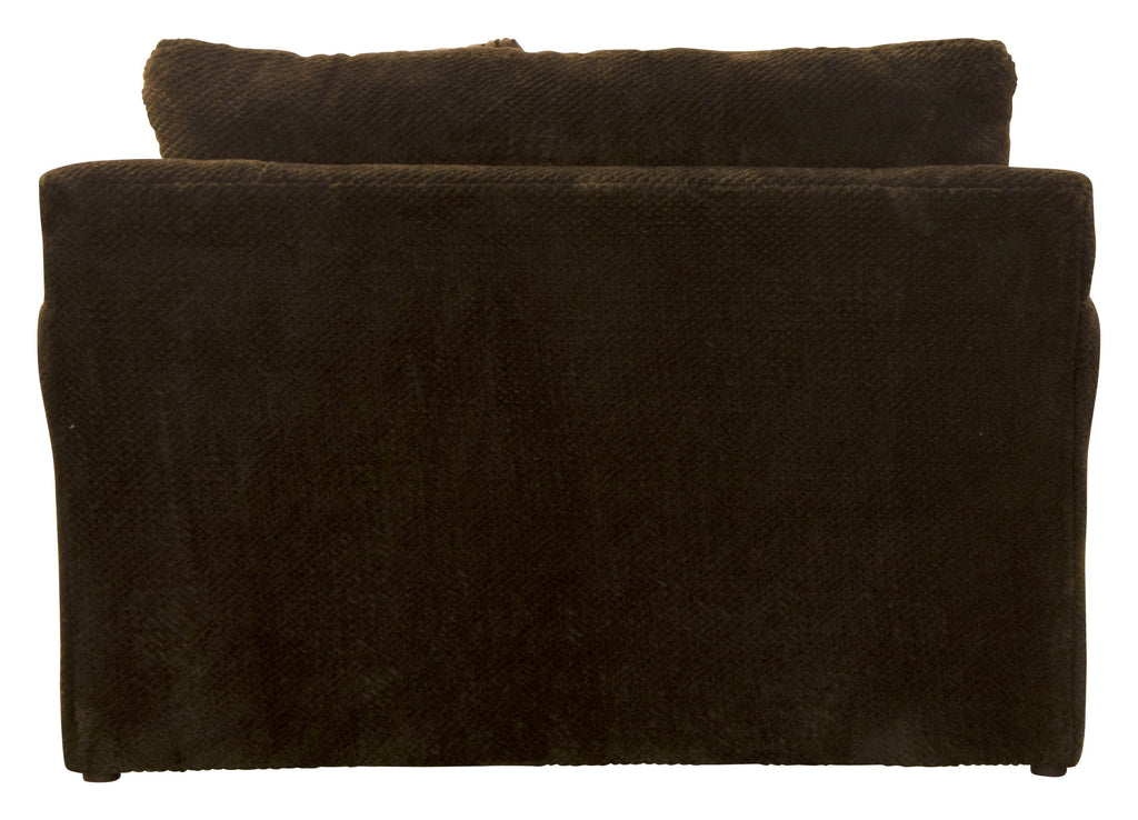 Dark upholstered armchair with tall back cushion and two accent pillows