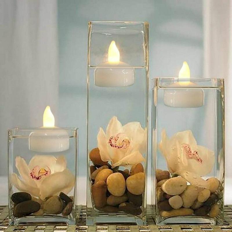 Flameless LED floating tea lights inside clear glass holders