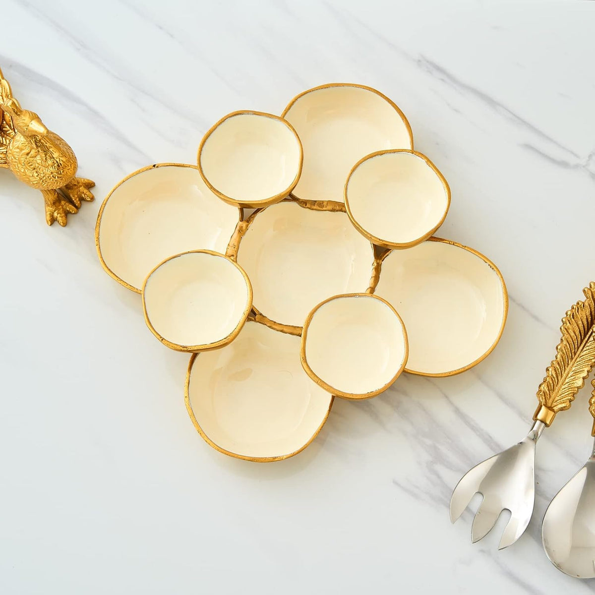 Nine round gold and white serving bowls clustered for serving snacks or dips