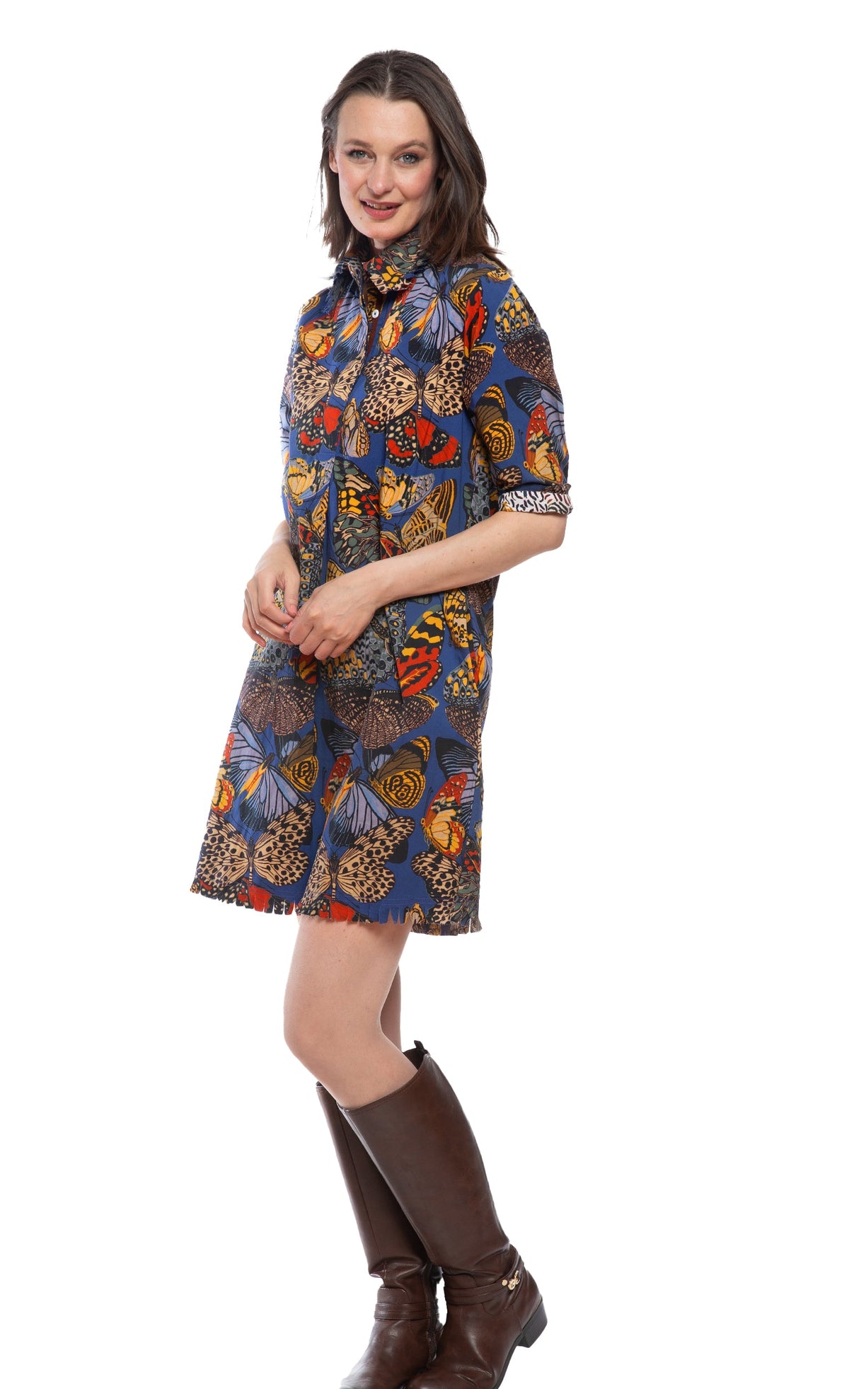 Blue butterfly print shirt dress with button front, collar, and ruffled skirt hem