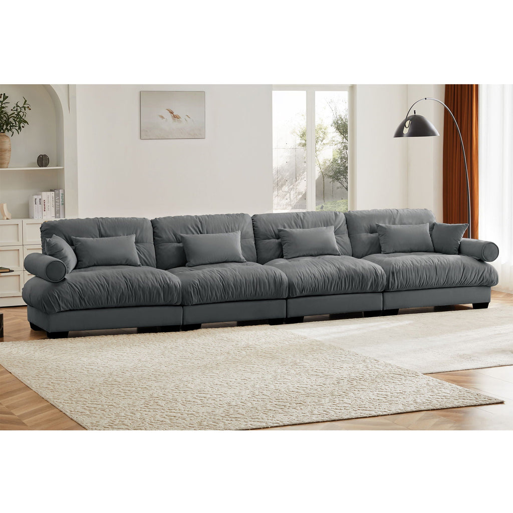 Dark gray modular L-shaped sectional sofa with deep seats and padded back pillows