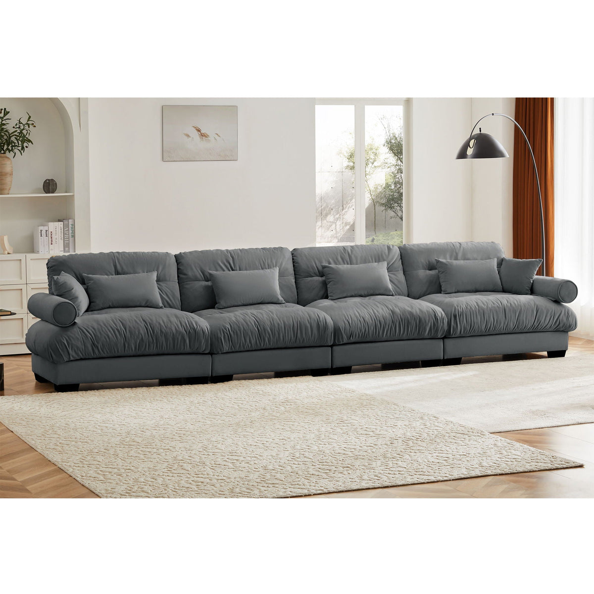 Dark gray modular L-shaped sectional sofa with deep seats and padded back pillows