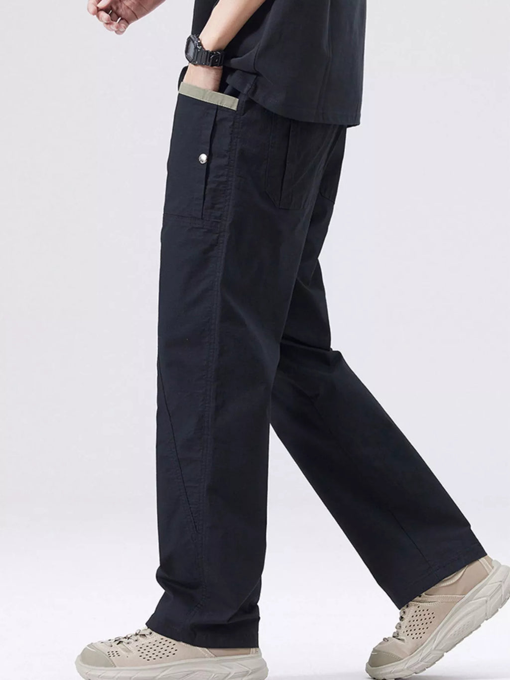 Men's black cargo pants with drawstring waist, side pockets, and straight legs.