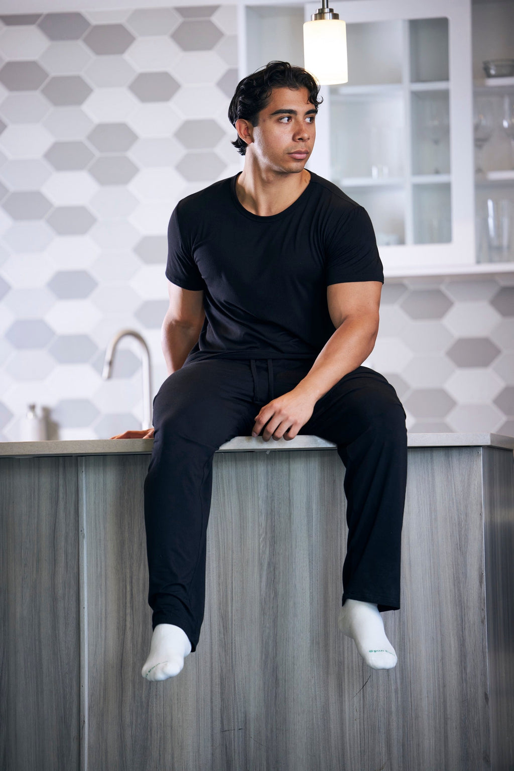 Men's black short-sleeve lounge pajama set with matching drawstring pants