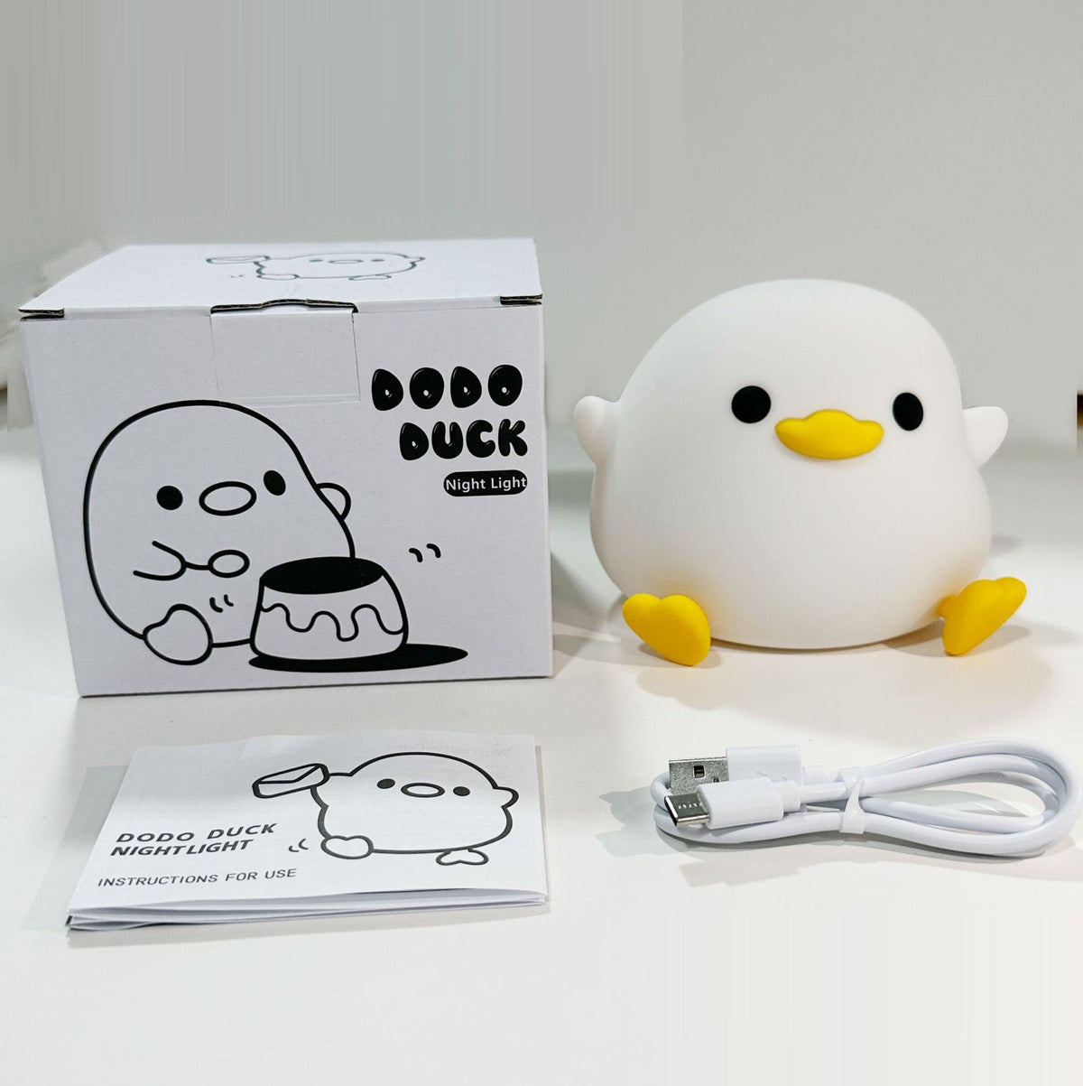 Duck silicone night light bundle with box, instruction paper, and USB charging cable