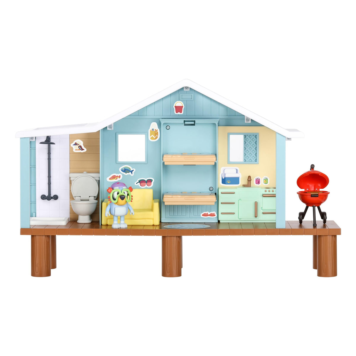 Beach cabin playset exterior view with bathroom fixtures, character figure, and grill