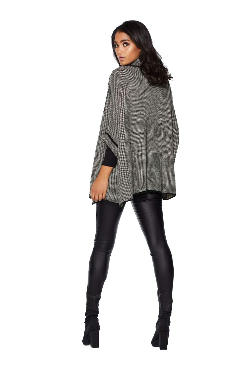 Grey speckled knit poncho cardigan with black trim and open draped front, side view