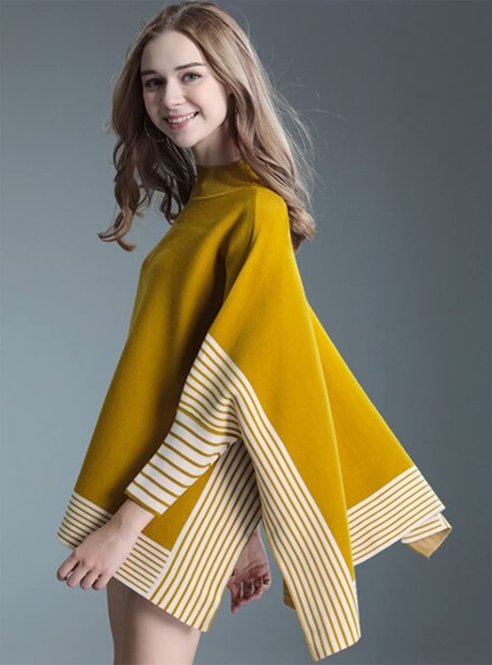 Mustard yellow striped knit poncho with mock neck, batwing sleeves and hem stripes