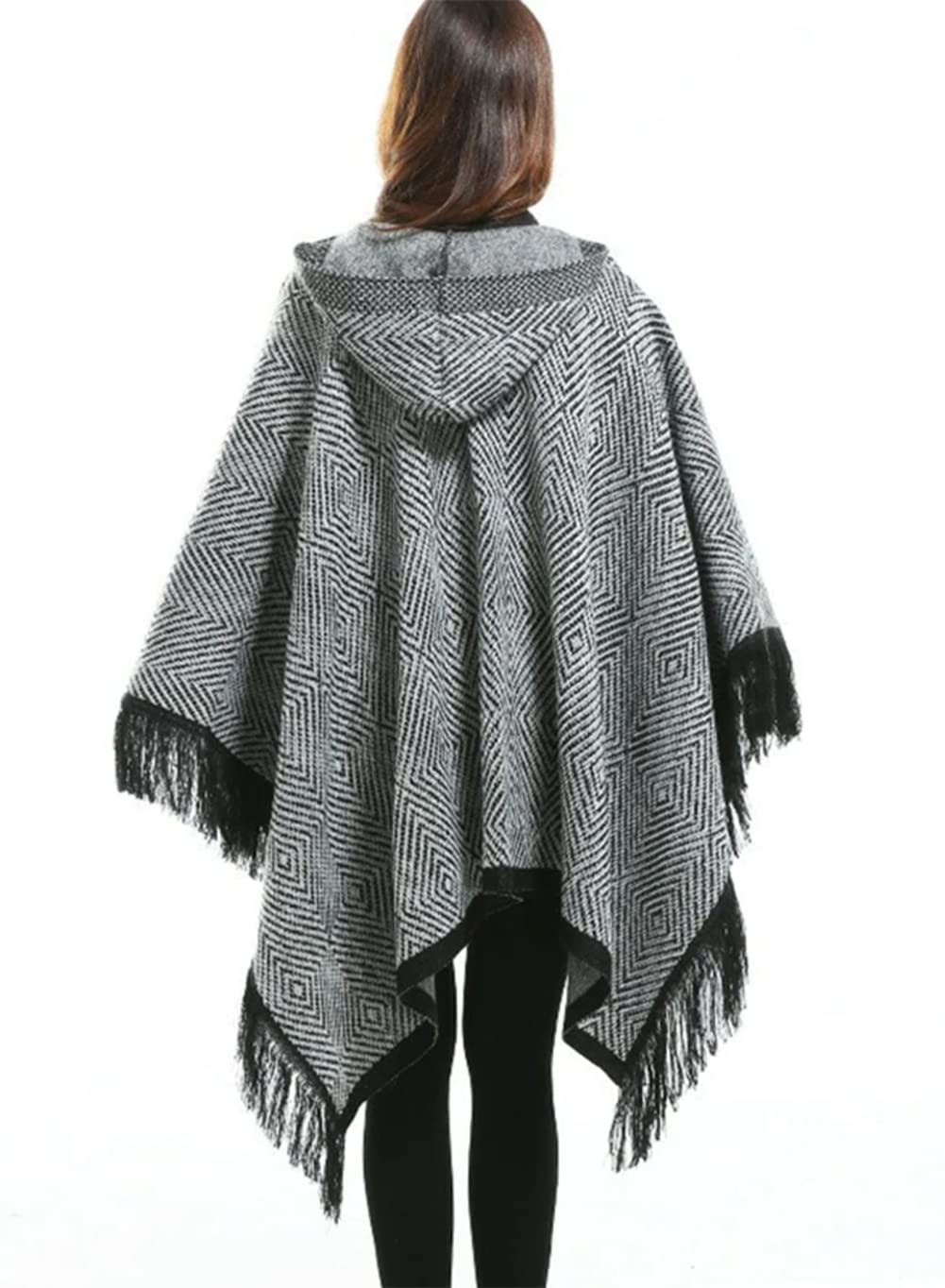 Women’s hooded poncho cape, back view, black-and-gray geometric knit with tassel fringe