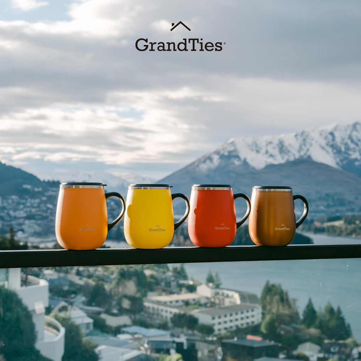 Set of four insulated mugs with handles in orange and yellow tones