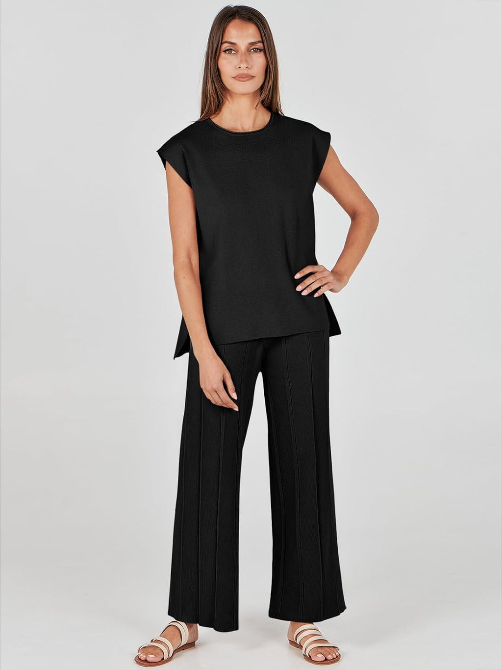 Black sleeveless top and wide-leg pants lounge set, model in casual pose