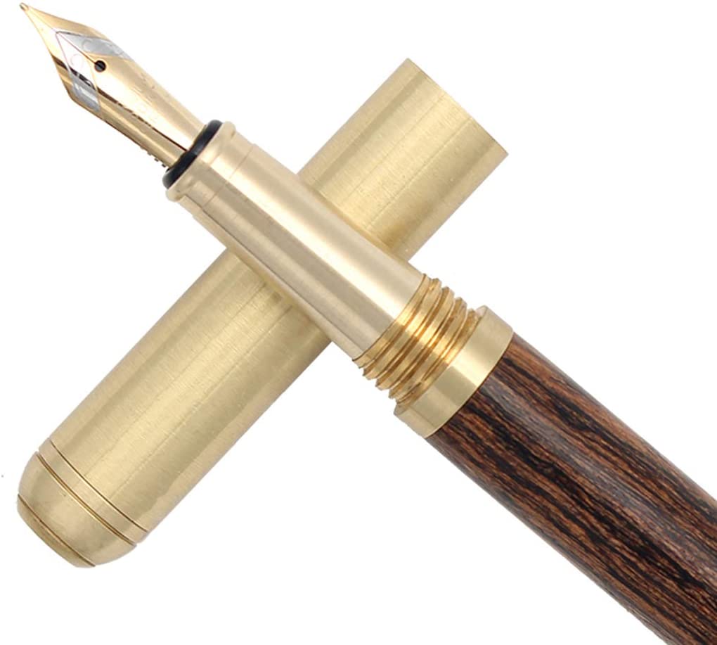 Handmade fountain pen with light wood barrel, brass cap, and gold nib close-up