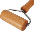 Close-up wooden rolling pin roller with U-shaped metal frame and rounded ends