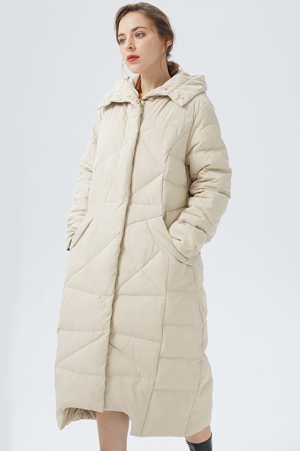 Women’s beige long puffer down coat with hood, side view, quilted stitch pattern