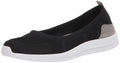 Women's slip-on sneaker with black mesh upper, gray heel patch, and white cushioned sole
