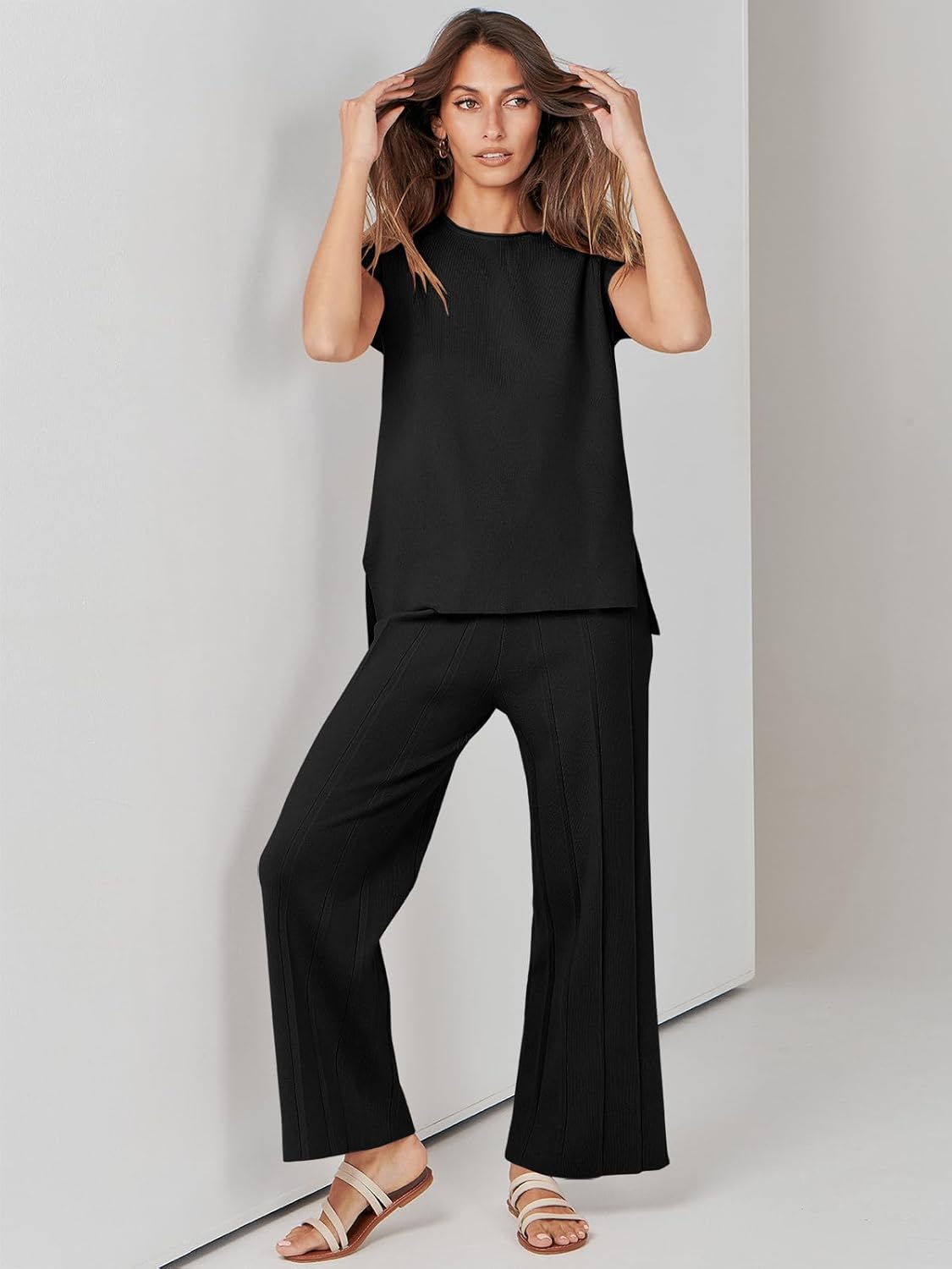 Black sleeveless lounge set with drapey wide-leg pants and top side split hem