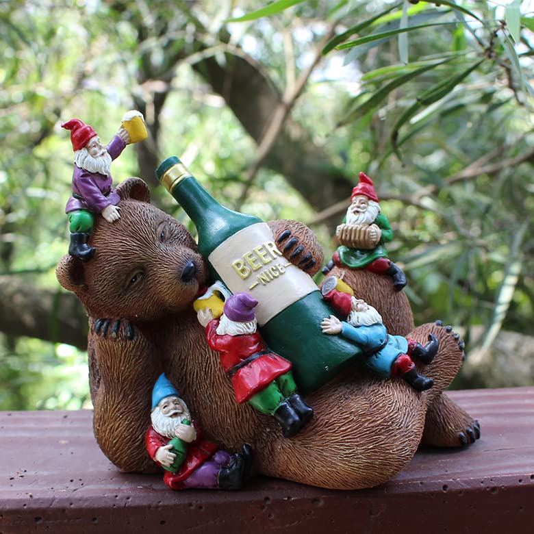Garden bear yard statue with green beer bottle and four gnome figurines on back