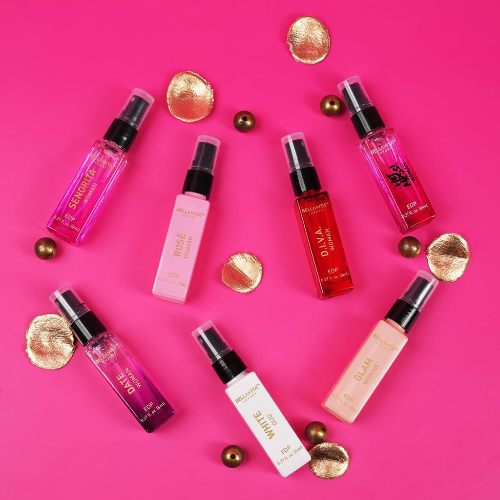 Assorted 8ml perfume discovery spray bottles in pink, red, gold, and clear