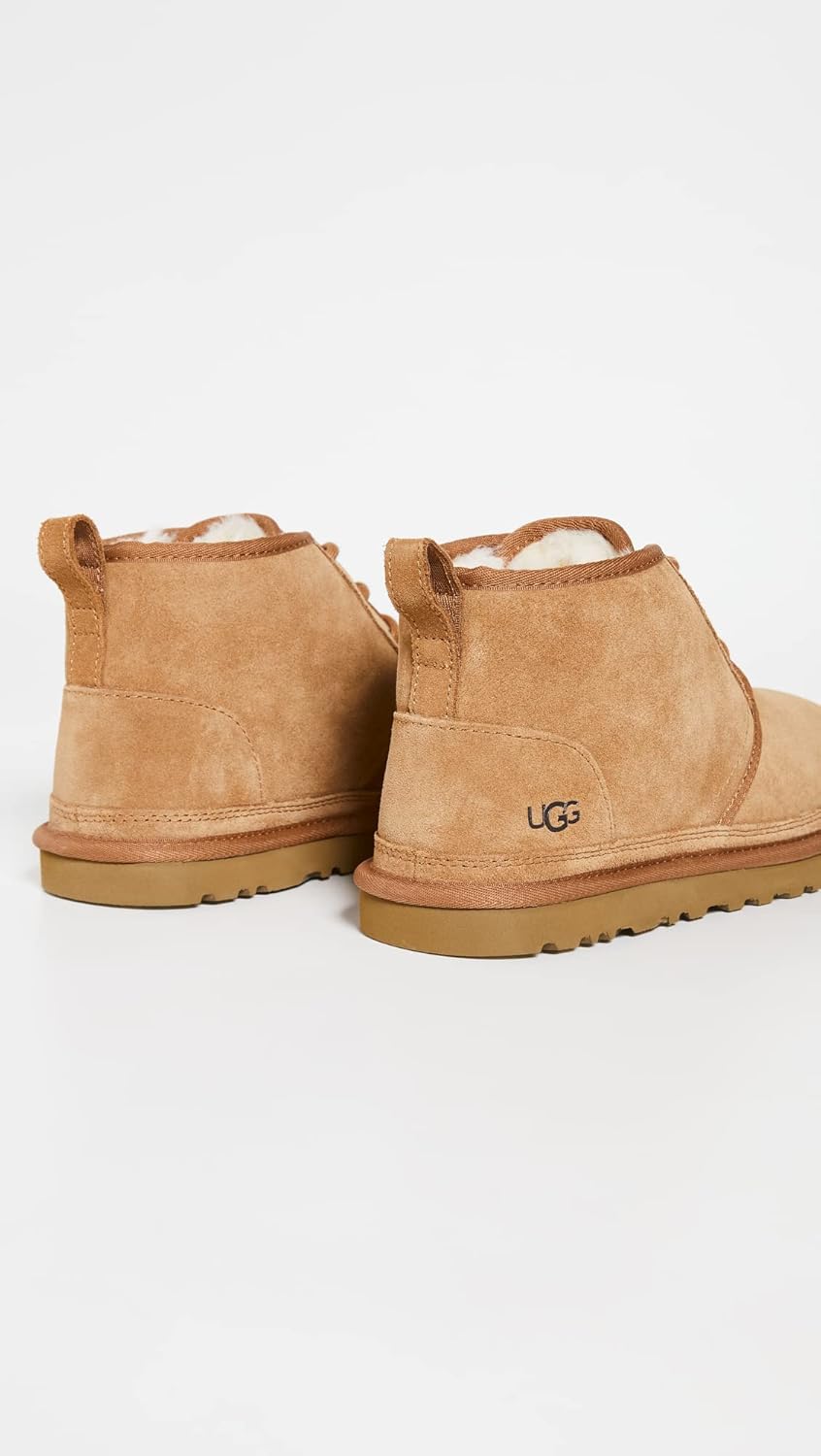 Pair of chestnut brown suede chukka boots, back view with tan lining and rubber soles