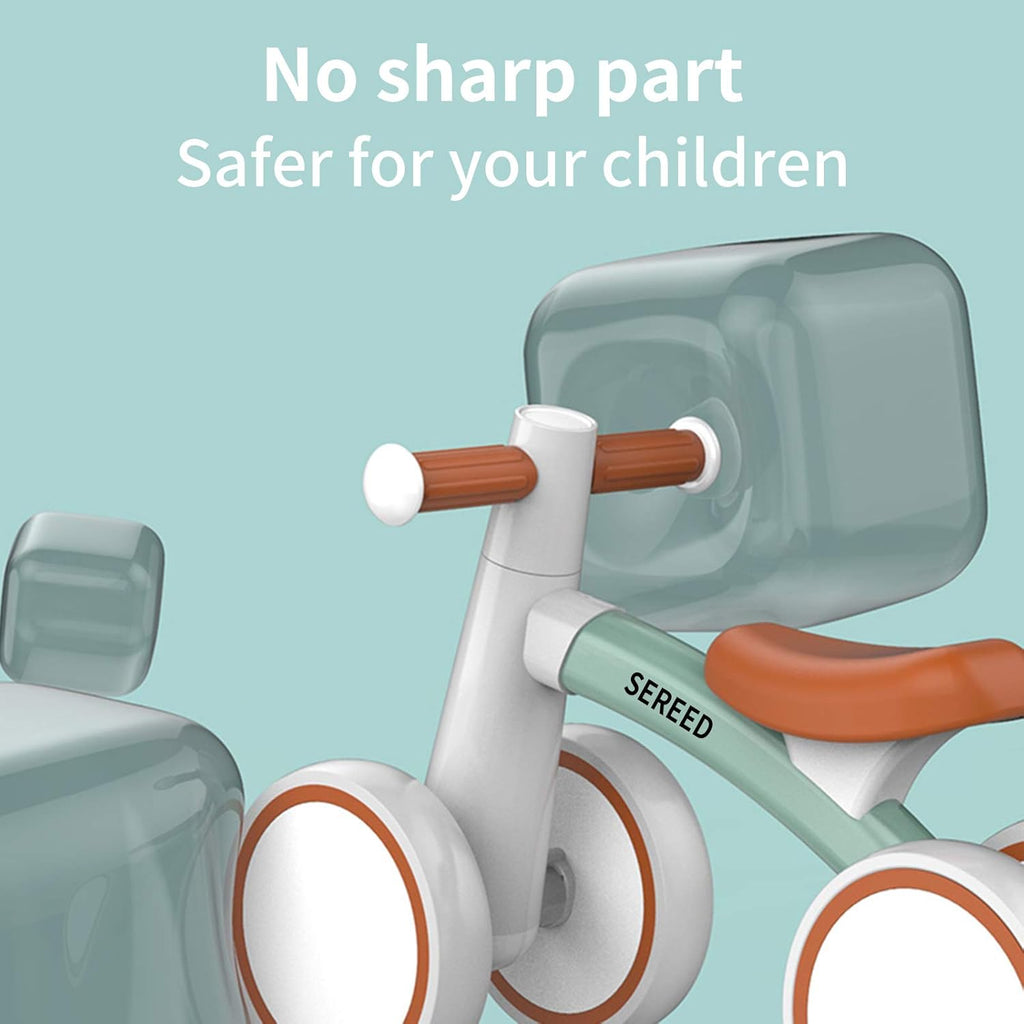Toddler balance bike with smooth design, green frame, orange seat, and white wheel pods